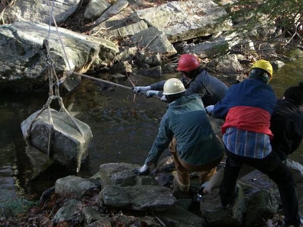 Placing stone step at Little Dam. Photo by Randy and Mara Miller.