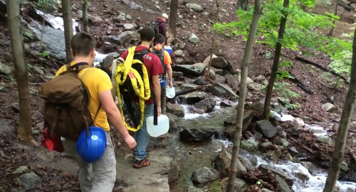 The Taconic Trail Crew hikes the Wilkinson Trail at Breakneck Ridge to get to their work site. Photo by Erik Mickelson