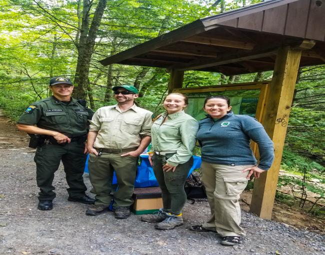 C. Stephens, Ian Dunn, Nikki Wowaka, and Sabina Cardenas greeted and educated visitors at the Blue Hole.